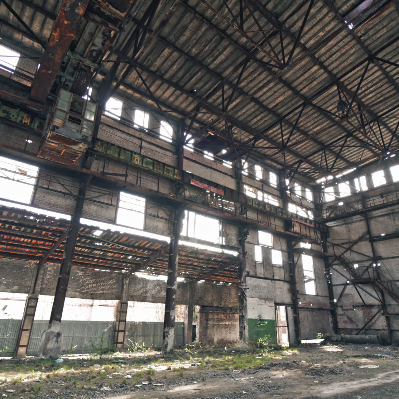 Ruined roof of an old abandoned factory. Industrial building for demolition.
