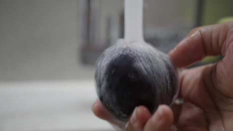 washing a plum
