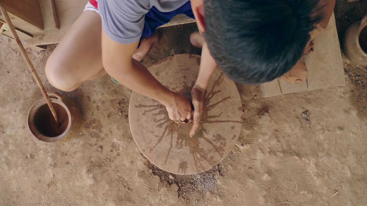 Artisan Making Pottery on a Wheel