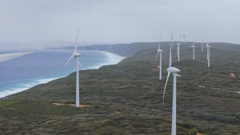 cinematic drone flight along coastline of albany wind farm