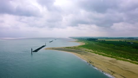 Static-aerial-landscape-of-a-cloudy-stormy-day-at-a-beach-in-England