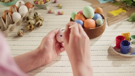 happy easter holiday. coloring eggs top view. woman preparing for easter, painting and decorating eggs. christian celebration, family traditions.