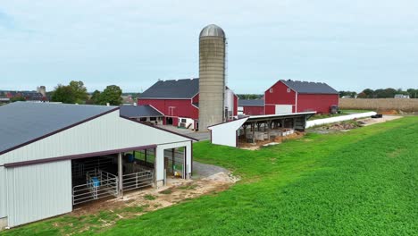 american farm with red barns and silo