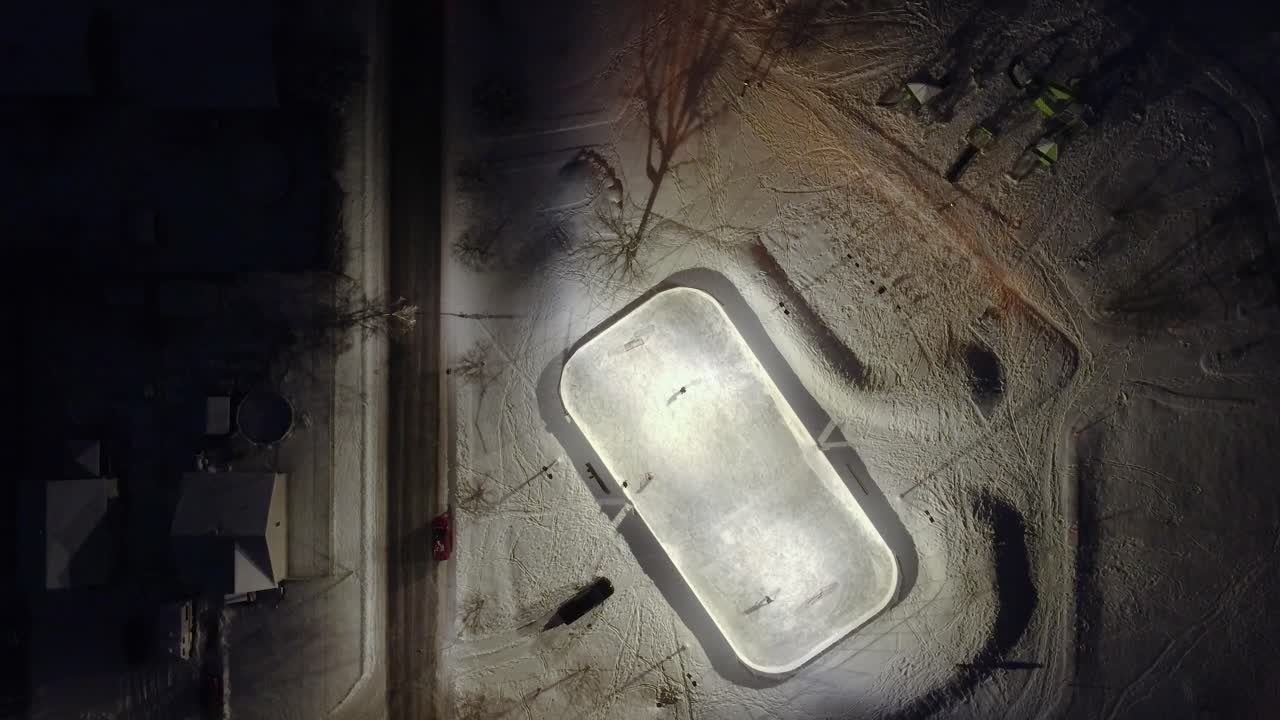 Top view of people exercising on a snow-covered city park field in Saint Constant, Quebec, Canada