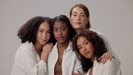 four beautiful women smiling at the camera