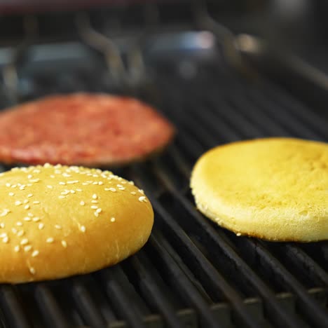 grilled burger cutlet beef minced meat patties. cooking beef and pork patty for burger. raw cutlet burger and two buns