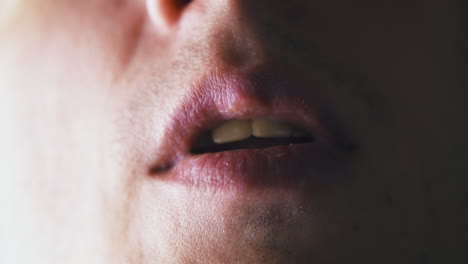 person runs tongue on lips and closes mouth after shaving