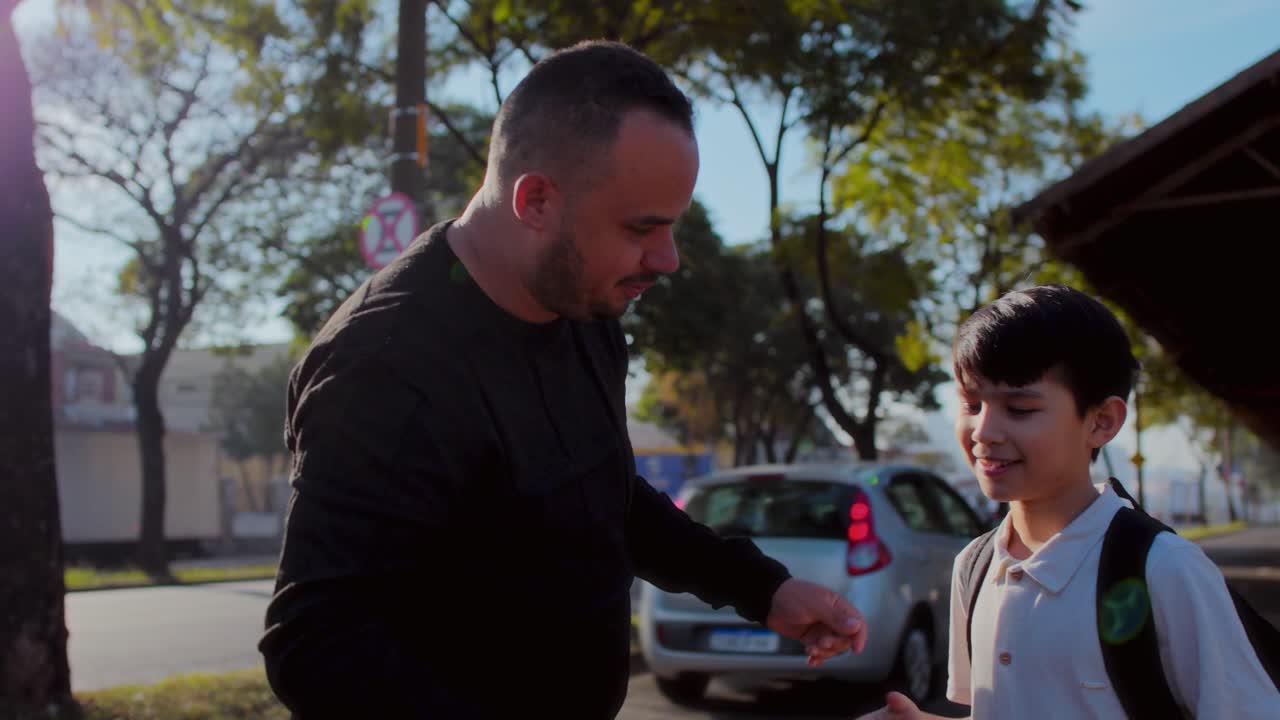 Father and Son Bonding Outdoors: Taking a Selfie and Daily Interactions
