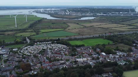 Aerial-view-above-Halton-North-England-Runcorn-Cheshire-countryside-wind-turbines-industry-landscape-reverse-orbit-right