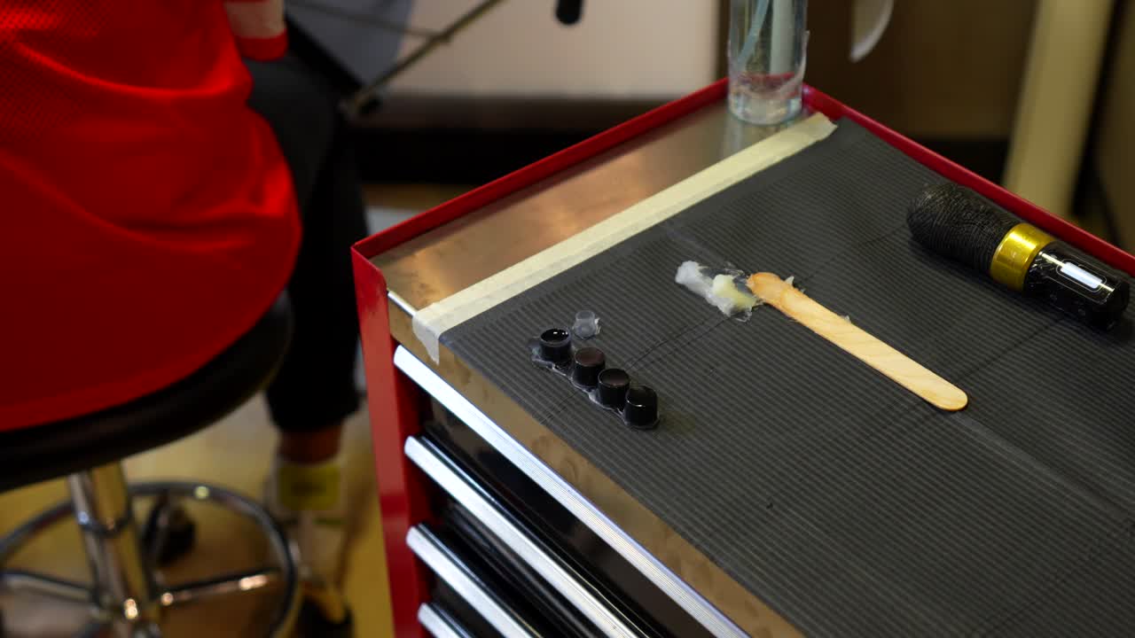 Tattoo setup with ink cups, tools and materials prepared for the tattooing process