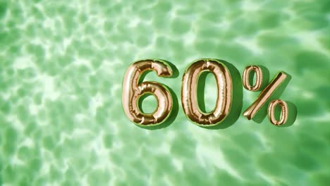 60% dourado flutuando acima das ondas da água em fundo verde