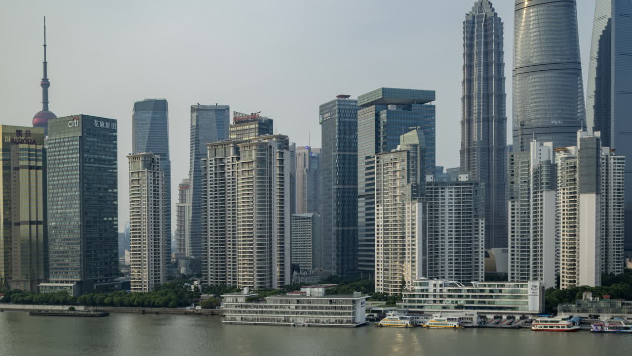 SHANGHAI, CHINA - 11 JUNE 2025 : Timelapse of the Shanghai city skyline from a high vantage point at night