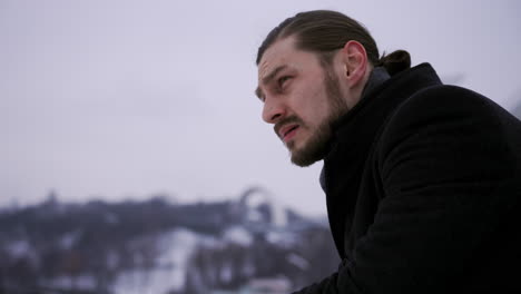 thoughtful man sitting on a bench