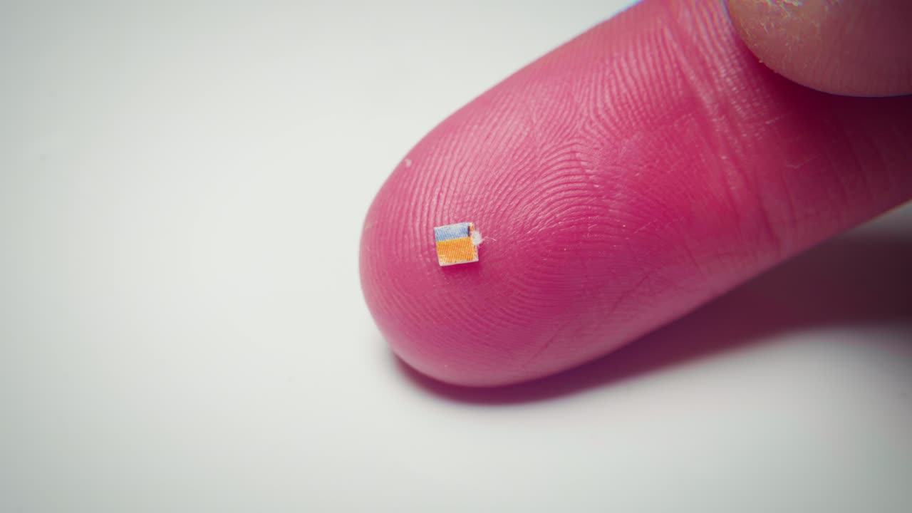 4K macro footage of a micro dose of LSD on a finger