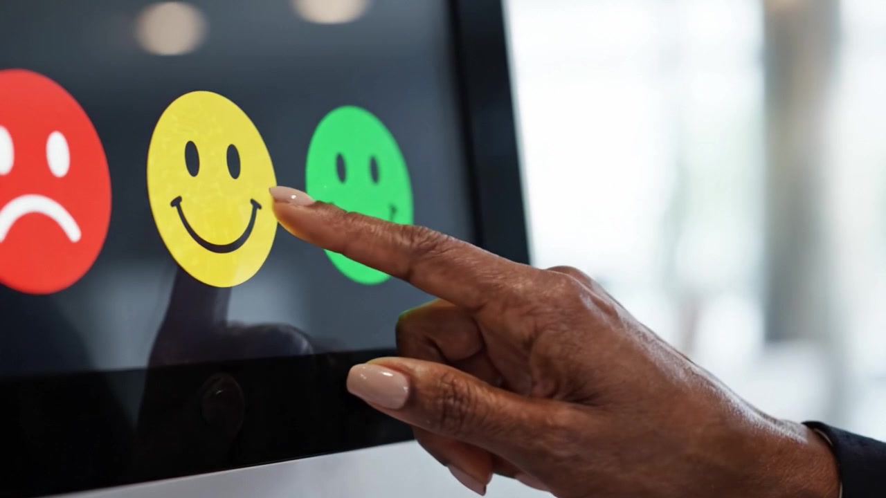 Visual Representation of Emotions with Icons: Transitioning from Negative to Positive Responses Illustrated by Colorful Smiley Faces in a Modern Digital Interface