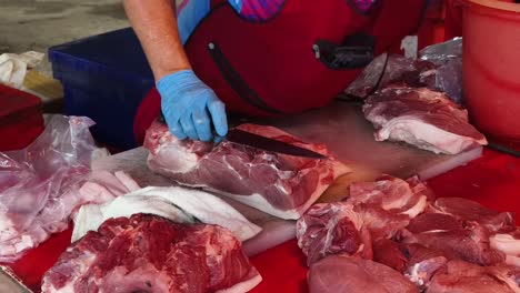 butchering pork at a market