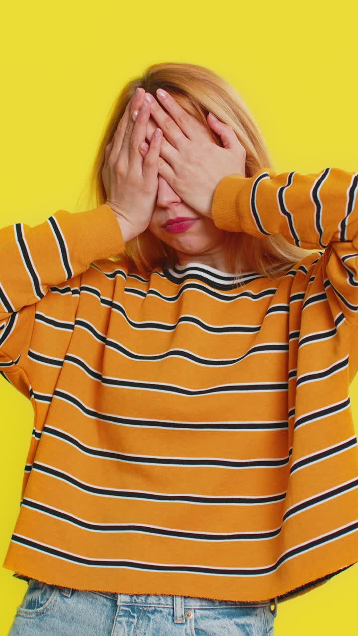 Afraid shocked woman closing eyes confused shy scared reject to watch phobia shame stress