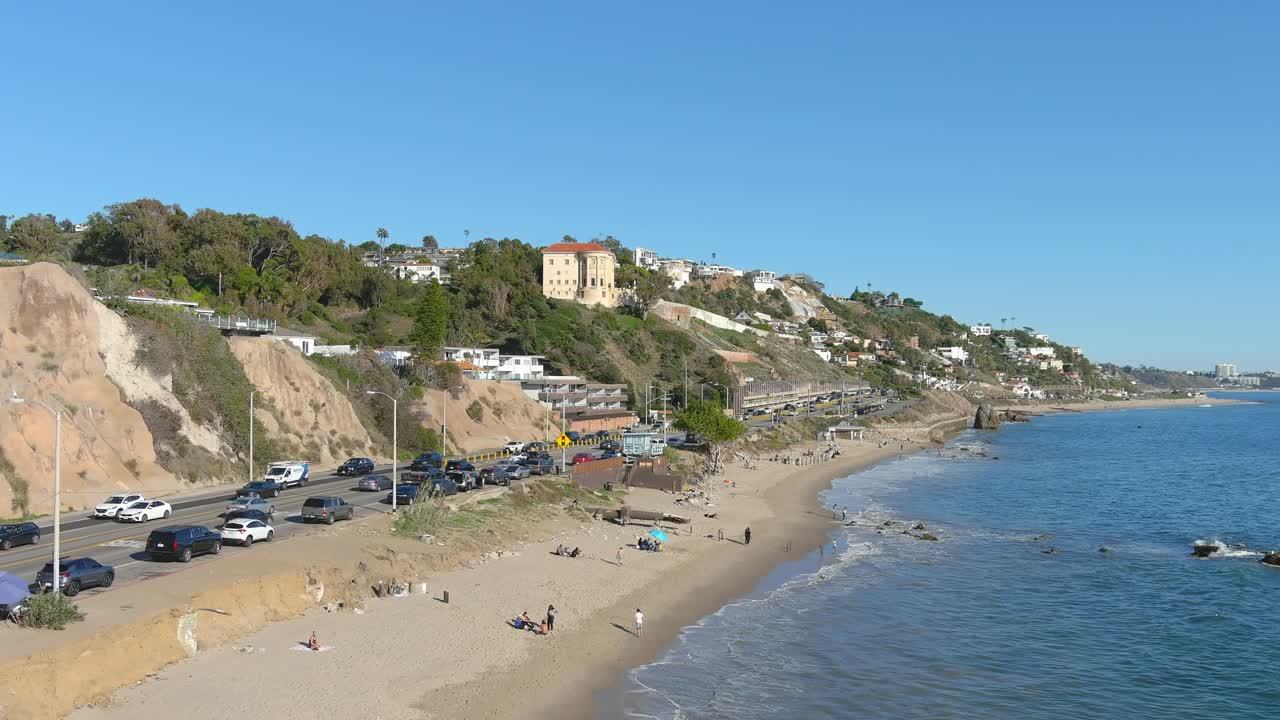 Aerial View of a Scenic Coastal Highway and Beach