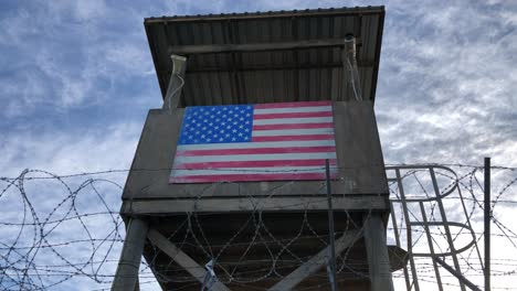 barb-wired-view-protected-fence-on-low-angle-and-blue-sky-as-pickup-shot-for-protected-army-base-area-or-confinement-military-or-secured-facility-protection-barrier