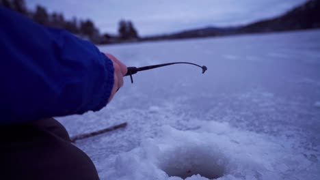 hands spinning fishing rod