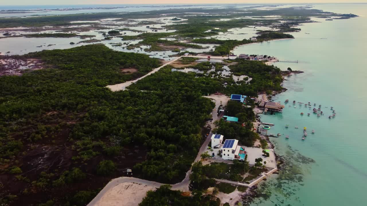 Aerial over the beach and resort near the 'Secret Beach Belize' on Ambergris Caye or Bay, Belize
