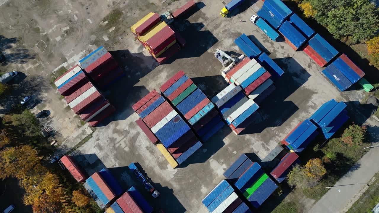 Aerial view of shipping containers, semi trucks cargo distribution of containers