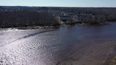 an aerial shot over a creek on a clear day