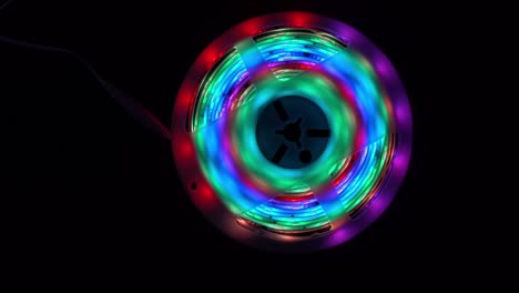 beautiful colorful led lightning circles against black background with lightning effects.