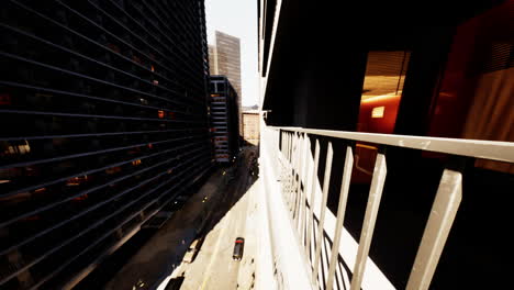 view from a balcony overlooking a bustling city street