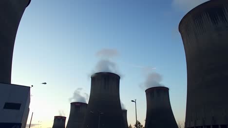 power plant cooling towers at sunset
