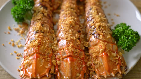 stir fried mantis shrimp with garlic on white plate