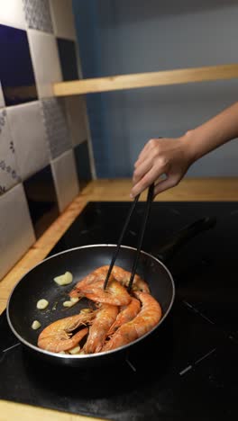 cooking shrimp in a kitchen