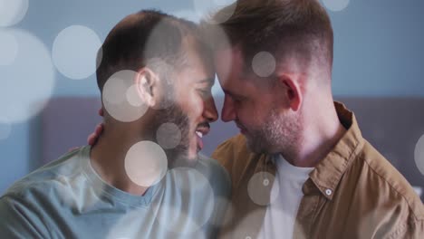 animation of light spots over diverse male couple embracing