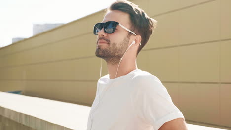 young man with headphones and sunglasses