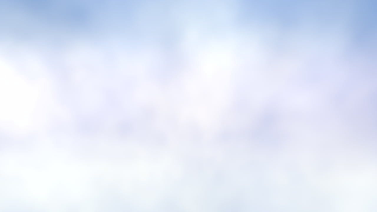 High angle shot of a light blue sky with fluffy white clouds