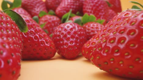 pile of fresh strawberries on table