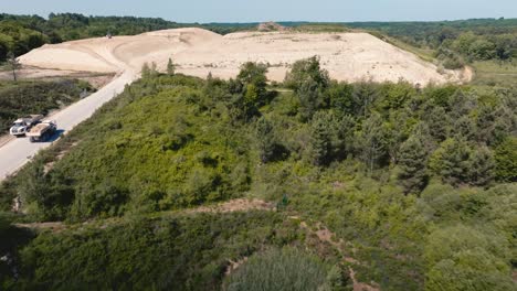 discovery of a landfill in the middle of the forest, wide drone shot of a landfill site