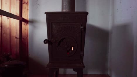 Norwegian-Wood-Stove-Inside-Mountain-Cabin.-closeup-shot