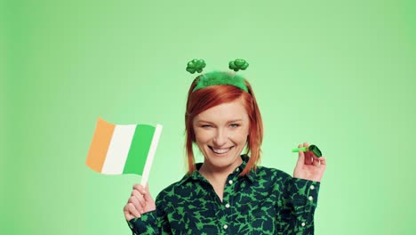 woman with a party horn blower and a irish flag