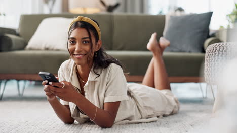 happy woman, phone and lying on living room floor