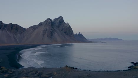 panorama shot of vestrahorn mountain on volcanic stokksnes beach during early morning on iceland island