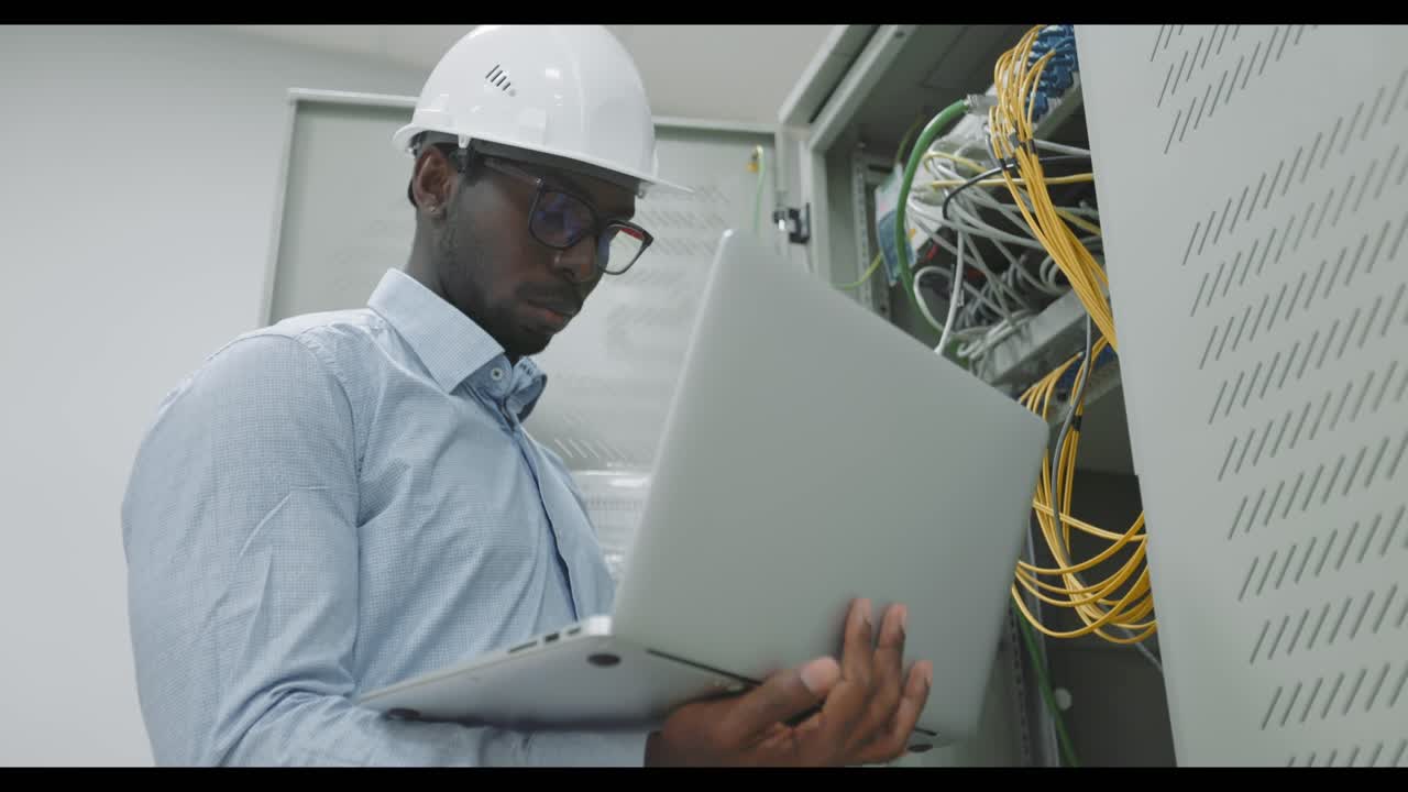 IT Technician working in a server room