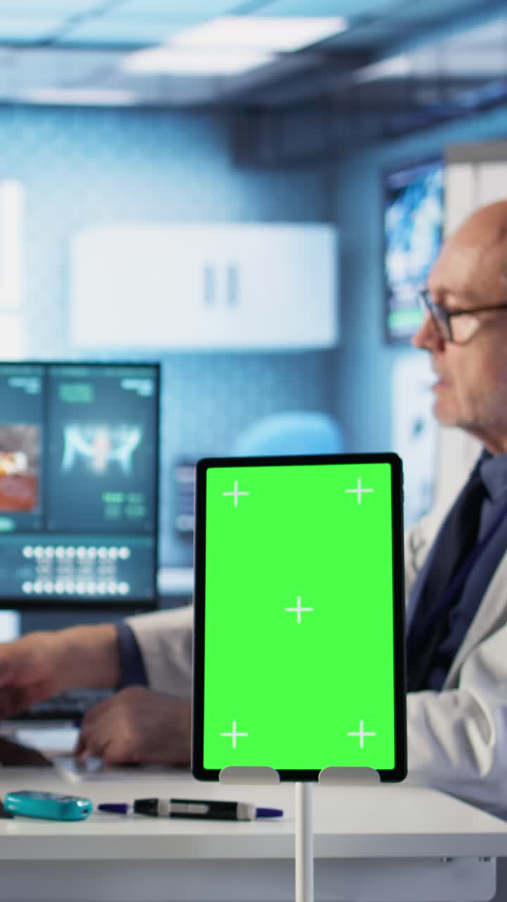 Doctor reviewing X-ray with tablet