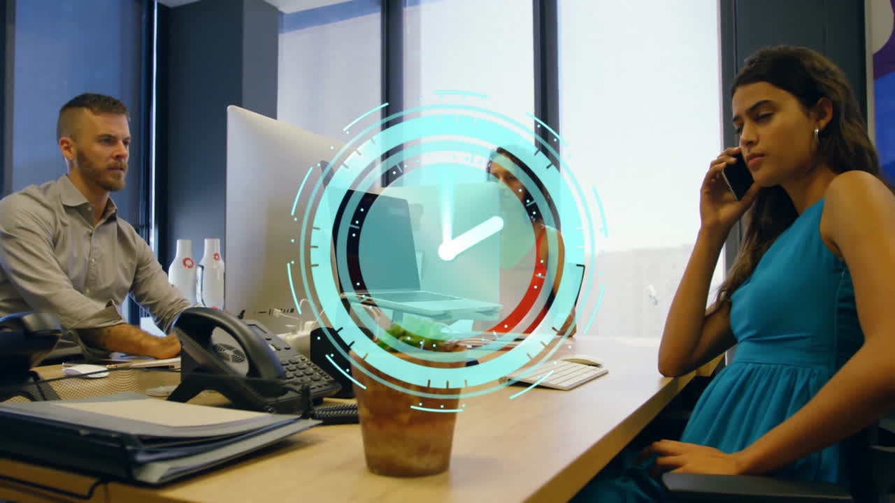 Clock animation overlaying business people working in modern office setting