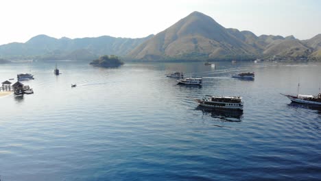 tourist boats at pulau kelor island in indonesia in komodo national park