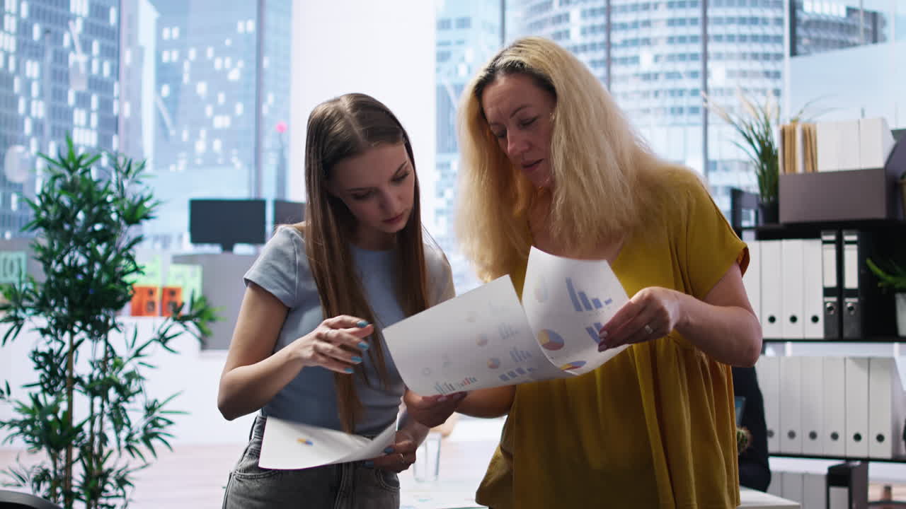Clients looking over statistical charts given by financial advisor