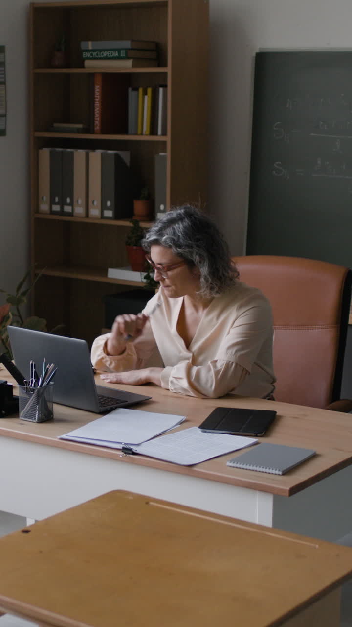 Teacher Working in Classroom