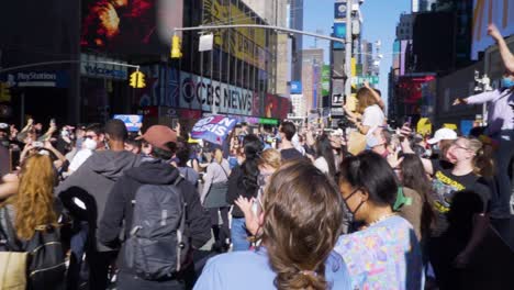a large crowd of biden-harris supporters gathers spontaneously in times square to celebrate the results of the 2020 presidential election.