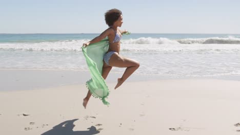 young woman running at the beach 4k