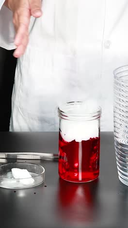 demonstrating dry ice reaction with red liquid